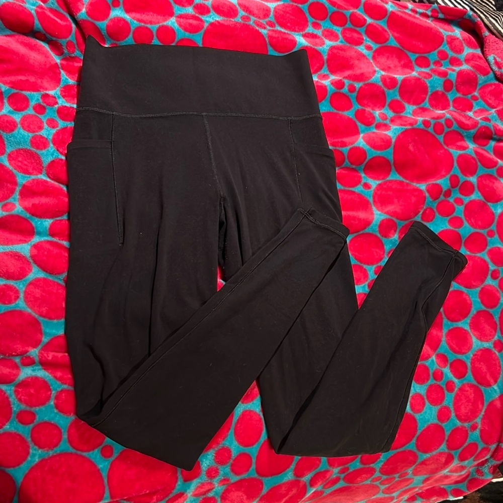 Athleta Salutation stash pocket tight (Medium Tall)